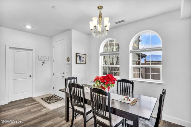 a bathroom with a glass shower door and a window