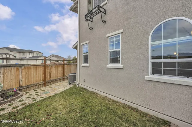 a roof deck with table and chairs
