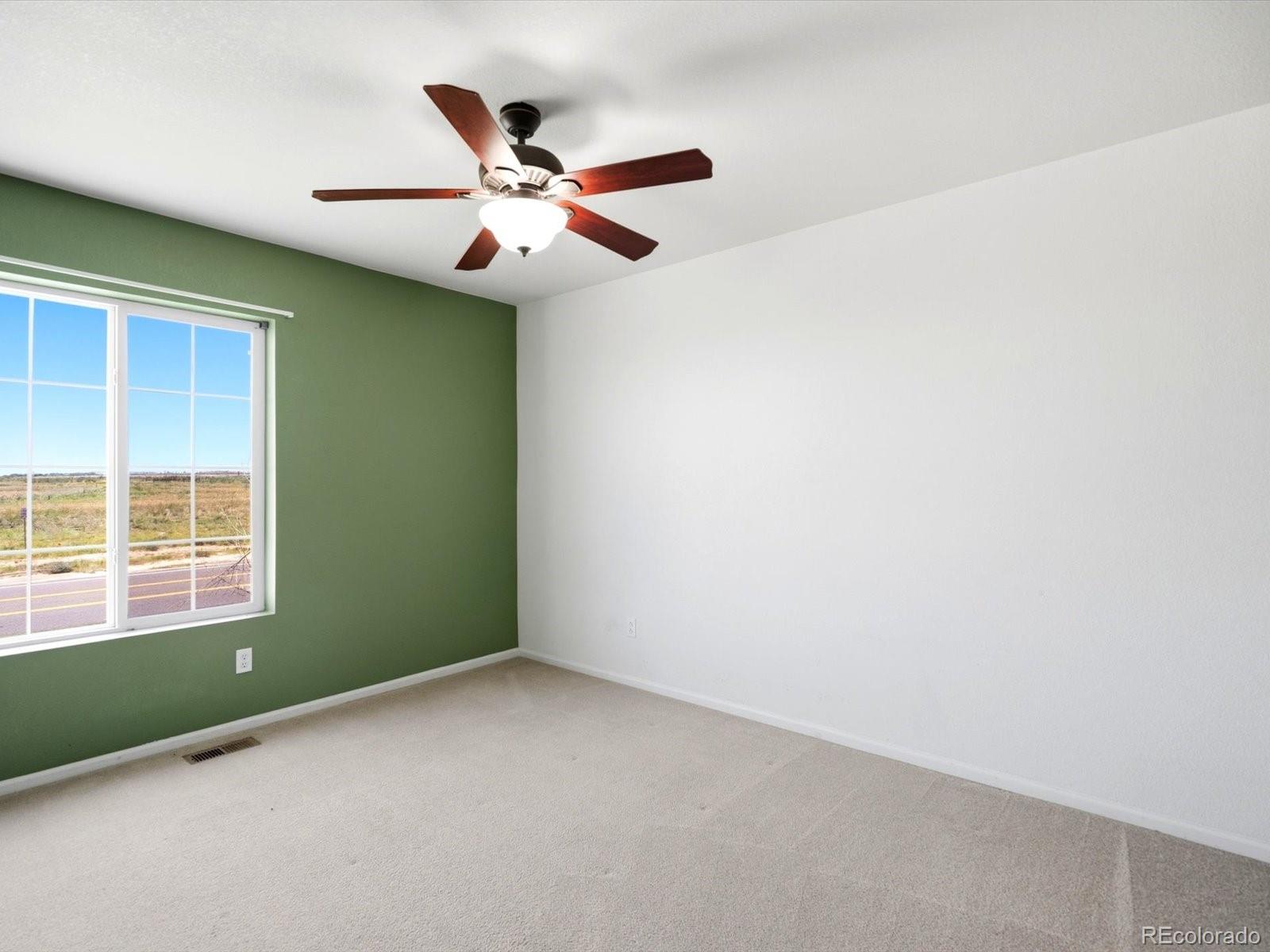 5444 Perth Court Denver, CO 80249 - Photo 34 of 46 a view of an empty room with a window