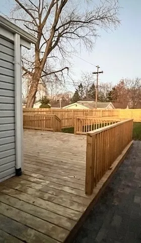 a view of swimming pool with wooden fence