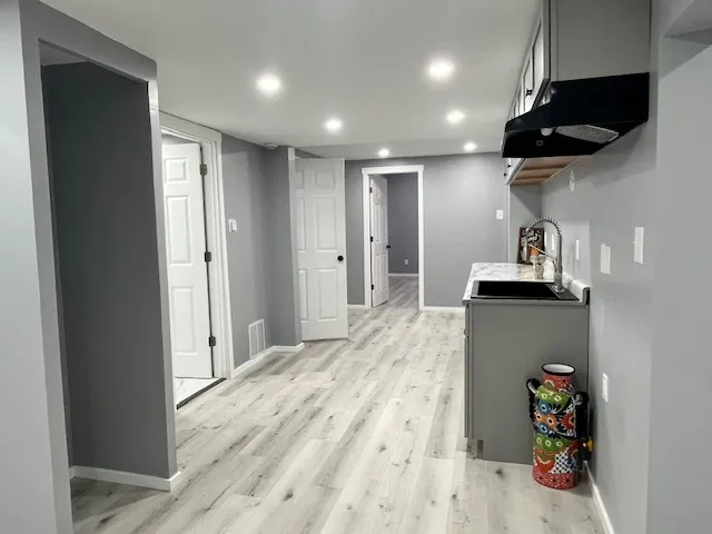a view of a living room and a flat screen tv