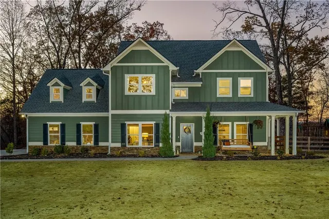 a front view of a house with a yard