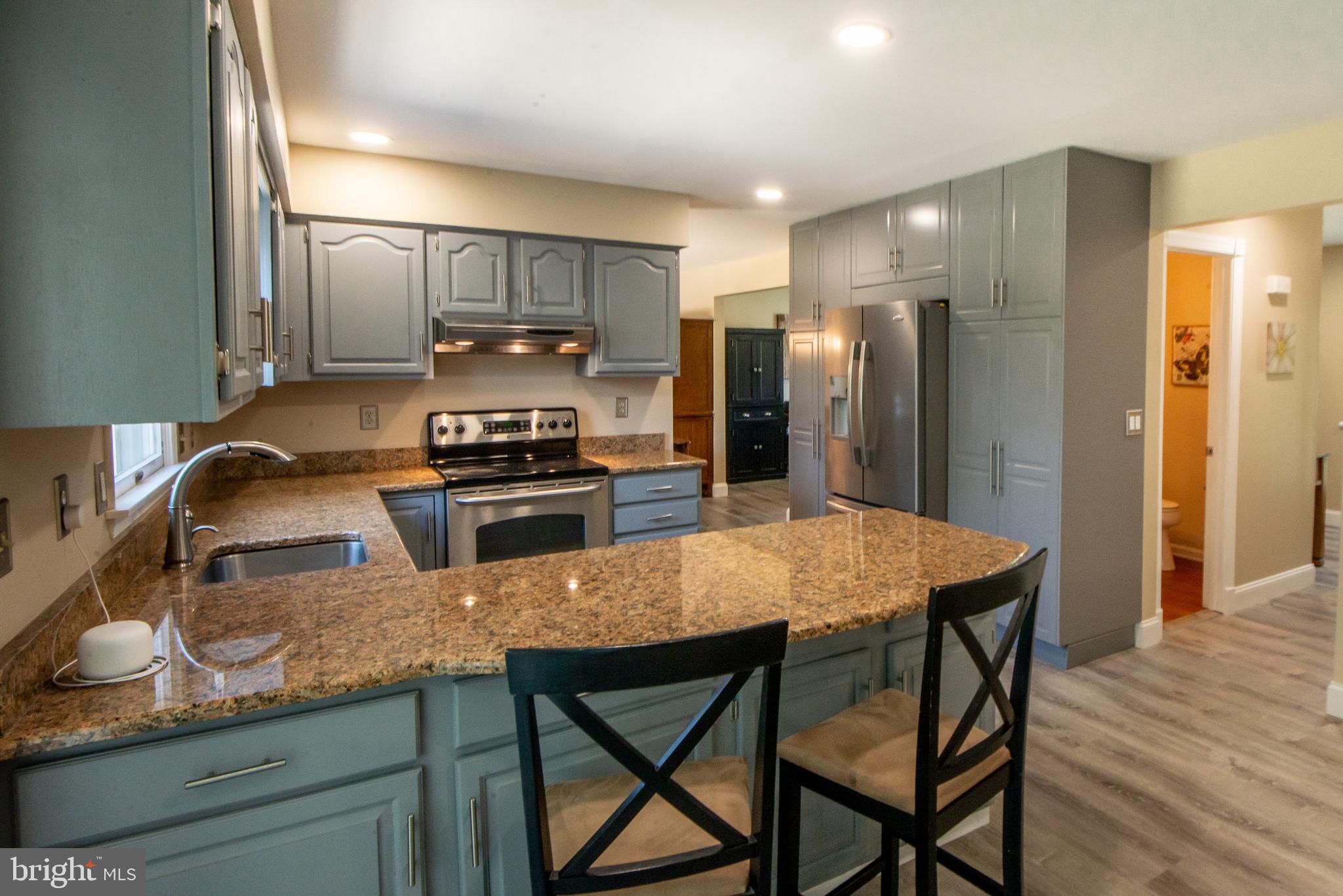 2919 Cub Hill Road Baltimore, MD 21234 - Photo 8 of 46 Breakfast bar with seating to chat with the cook