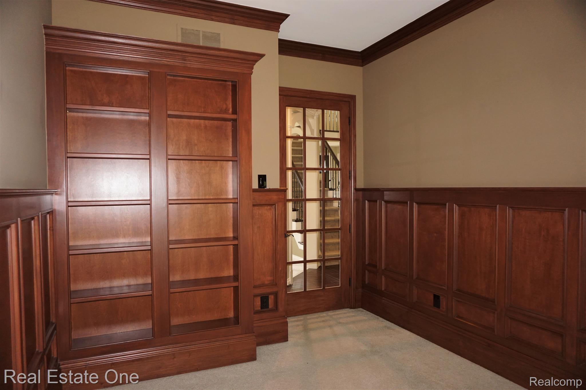 2949 Ambleside Court Rochester, MI 48306 - Photo 29 of 67 Library with Custom Bookshelves & Wainscoting