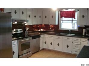 13220 Mayes Road Huntersville, NC 28078 - Photo 2 of 13 a kitchen with appliances cabinets and a sink