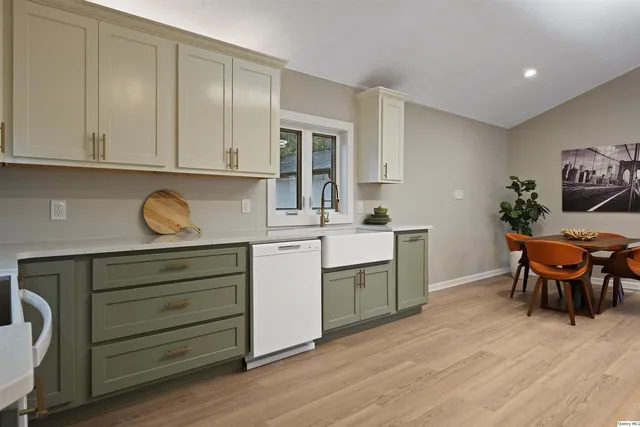 a kitchen with a sink and cabinets
