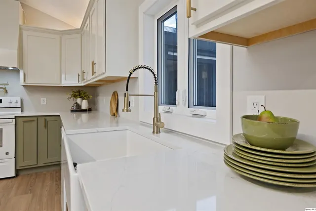 a kitchen with a sink and a refrigerator