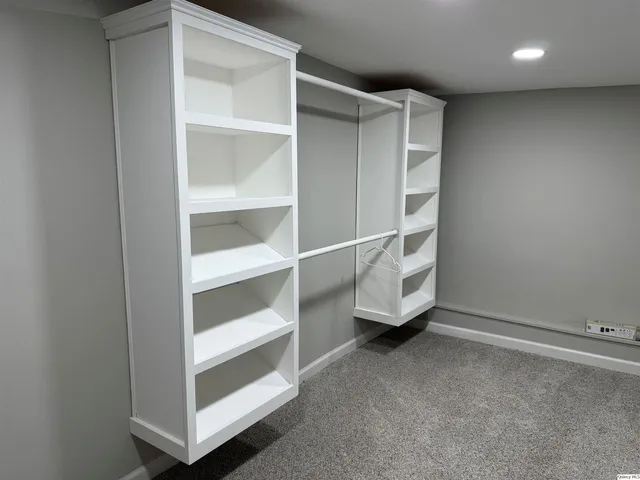 a view of an empty walk in closet