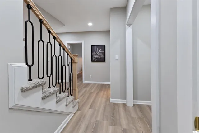 a view of staircase with wooden floor and staircase