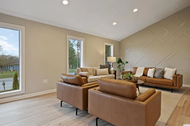 a living room with furniture and a window