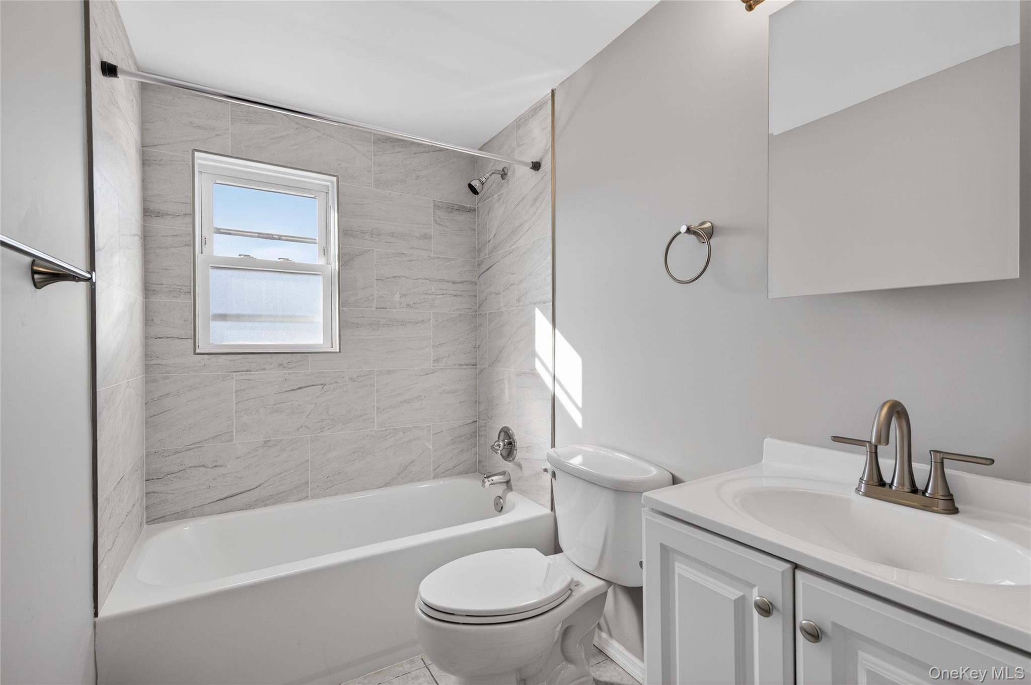 28 Candle Lane Levittown, NY 11756 - Photo 14 of 18 a bathroom with a sink toilet and shower