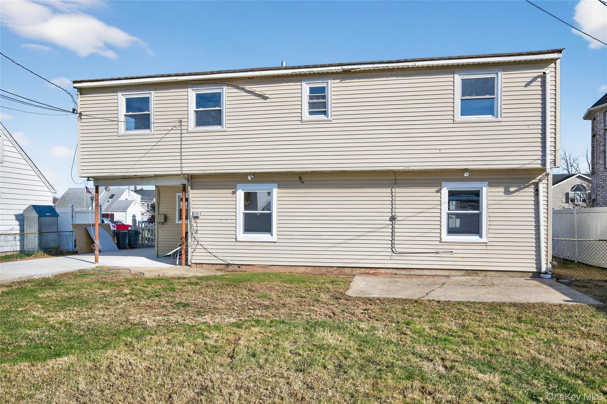 28 Candle Lane Levittown, NY 11756 - Photo 15 of 18 a view of a house with a backyard