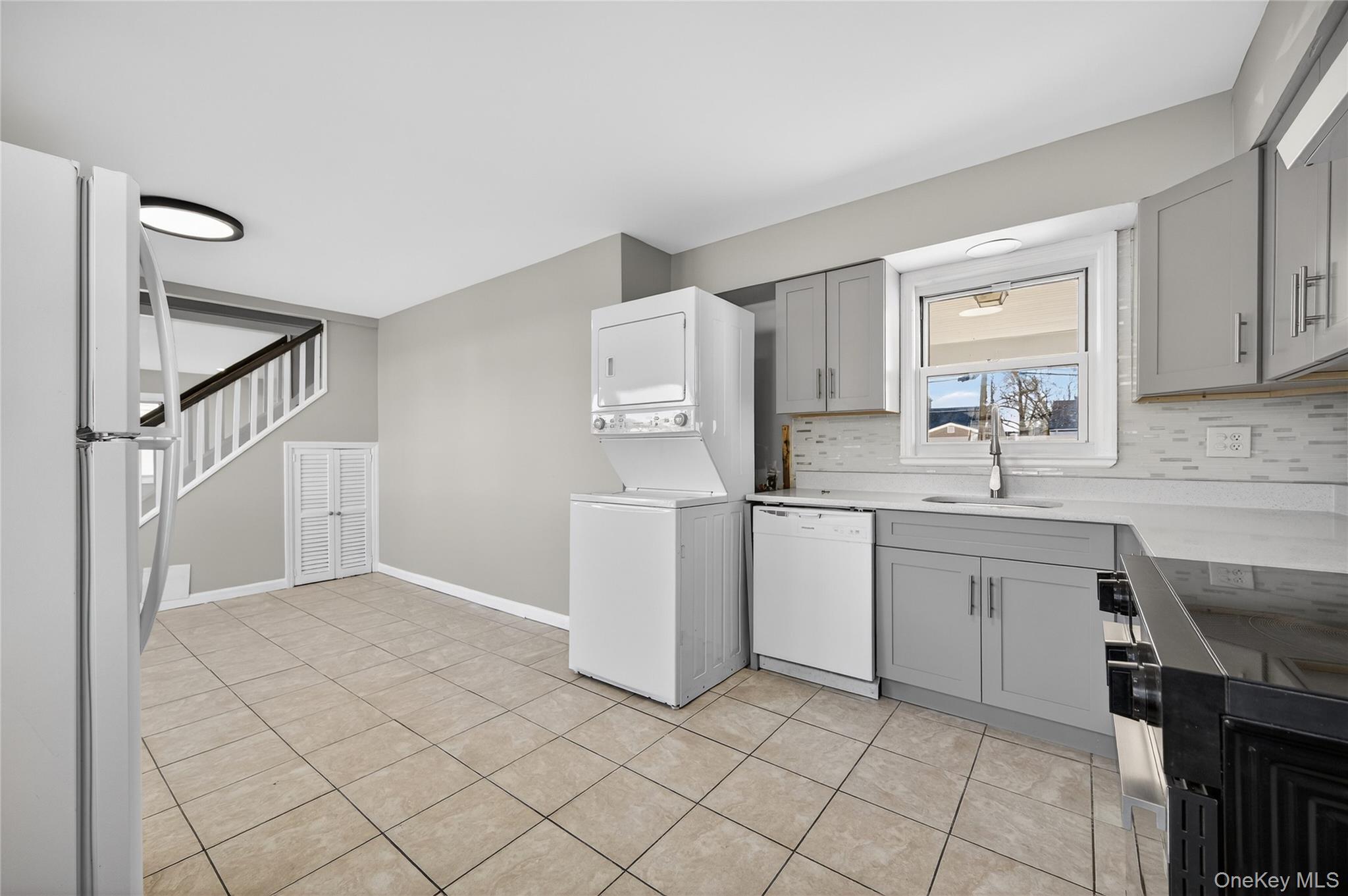 28 Candle Lane Levittown, NY 11756 - Photo 6 of 18 a kitchen with a sink cabinets and window