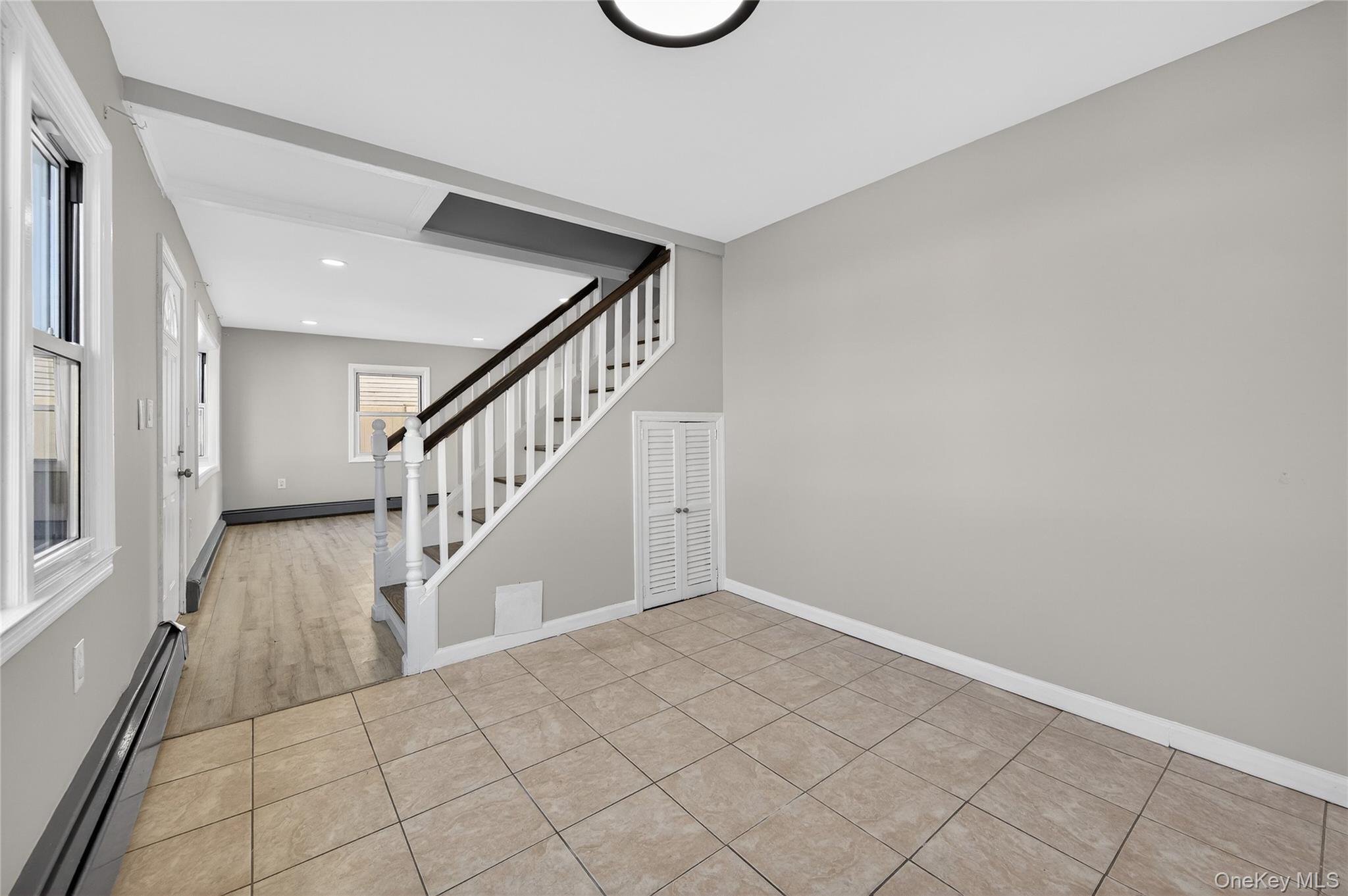 28 Candle Lane Levittown, NY 11756 - Photo 7 of 18 a view of an entryway with wooden floor