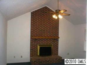 201 Baucom Deese Road Monroe, NC 28110 - Photo 3 of 8 a view of an empty room with a fireplace