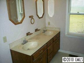 201 Baucom Deese Road Monroe, NC 28110 - Photo 4 of 8 a bathroom with a sink and a mirror