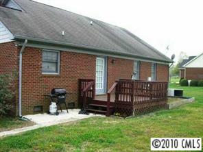 201 Baucom Deese Road Monroe, NC 28110 - Photo 5 of 8 a view of backyard with wooden fence and a bench