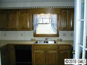 201 Baucom Deese Road Monroe, NC 28110 - Photo 7 of 8 a kitchen with a sink a cabinets and window