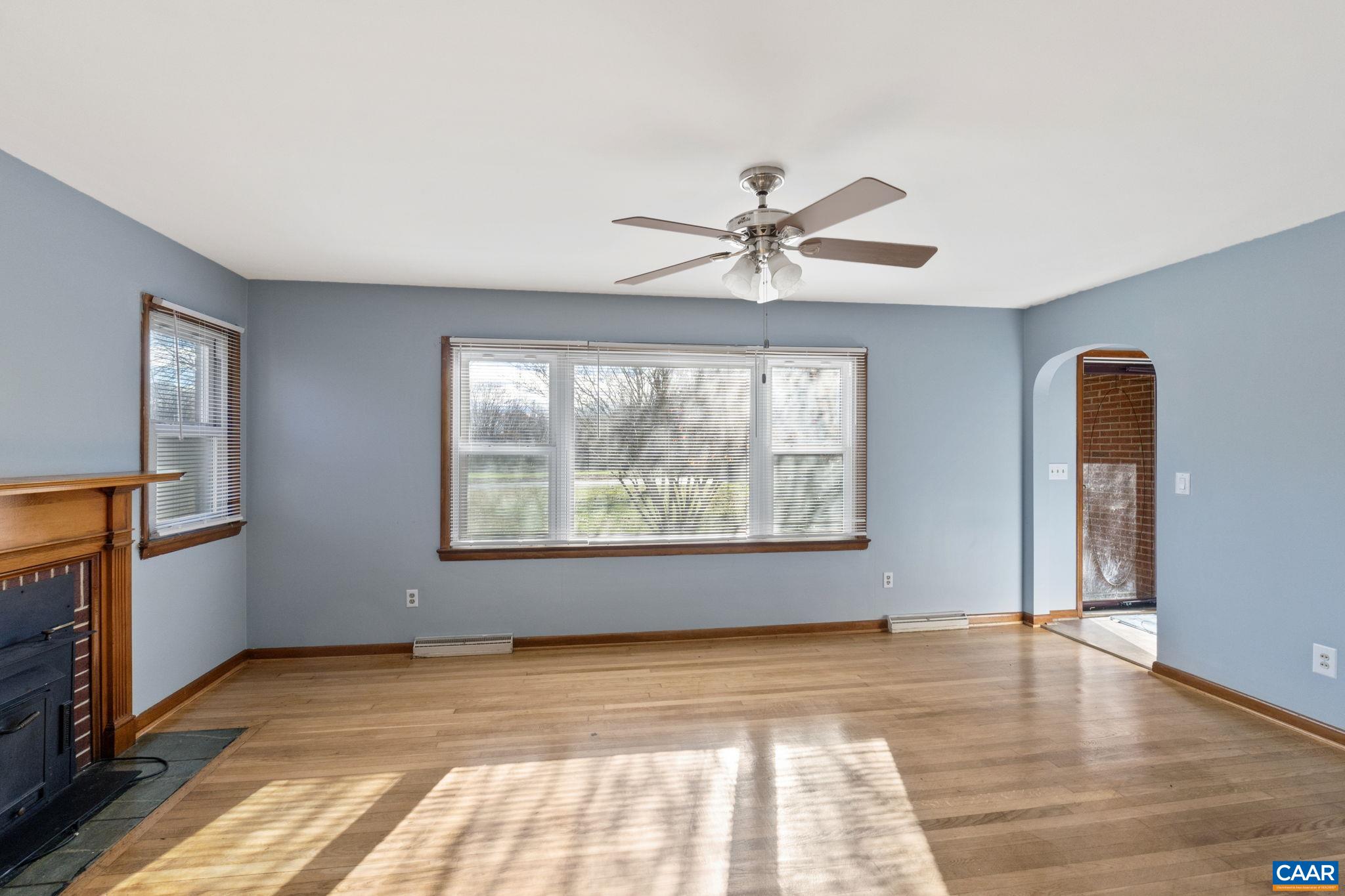 855 Moore Road Ruckersville, VA 22968 - Photo 8 of 39 a view of an empty room with a window and wooden floor
