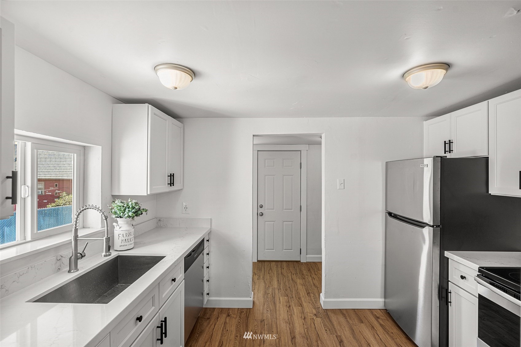 2228 Main Street Everett, WA 98203 - Photo 19 of 29 a kitchen with a refrigerator and a sink