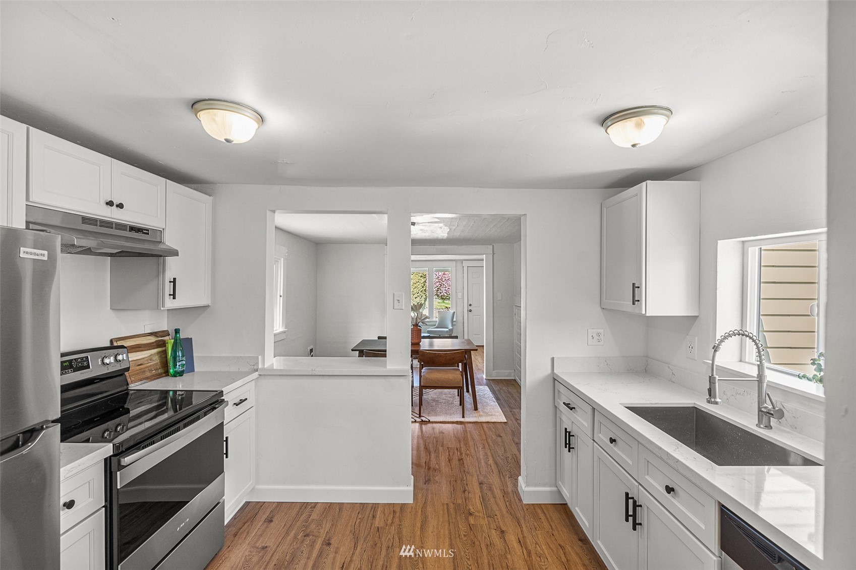 2228 Main Street Everett, WA 98203 - Photo 24 of 29 a large kitchen with stainless steel appliances a stove a sink dishwasher and a refrigerator
