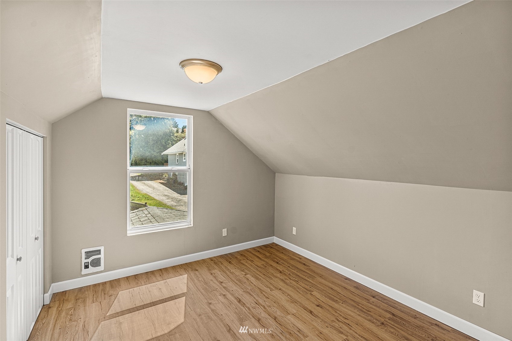 2228 Main Street Everett, WA 98203 - Photo 26 of 29 an empty room with wooden floor and windows