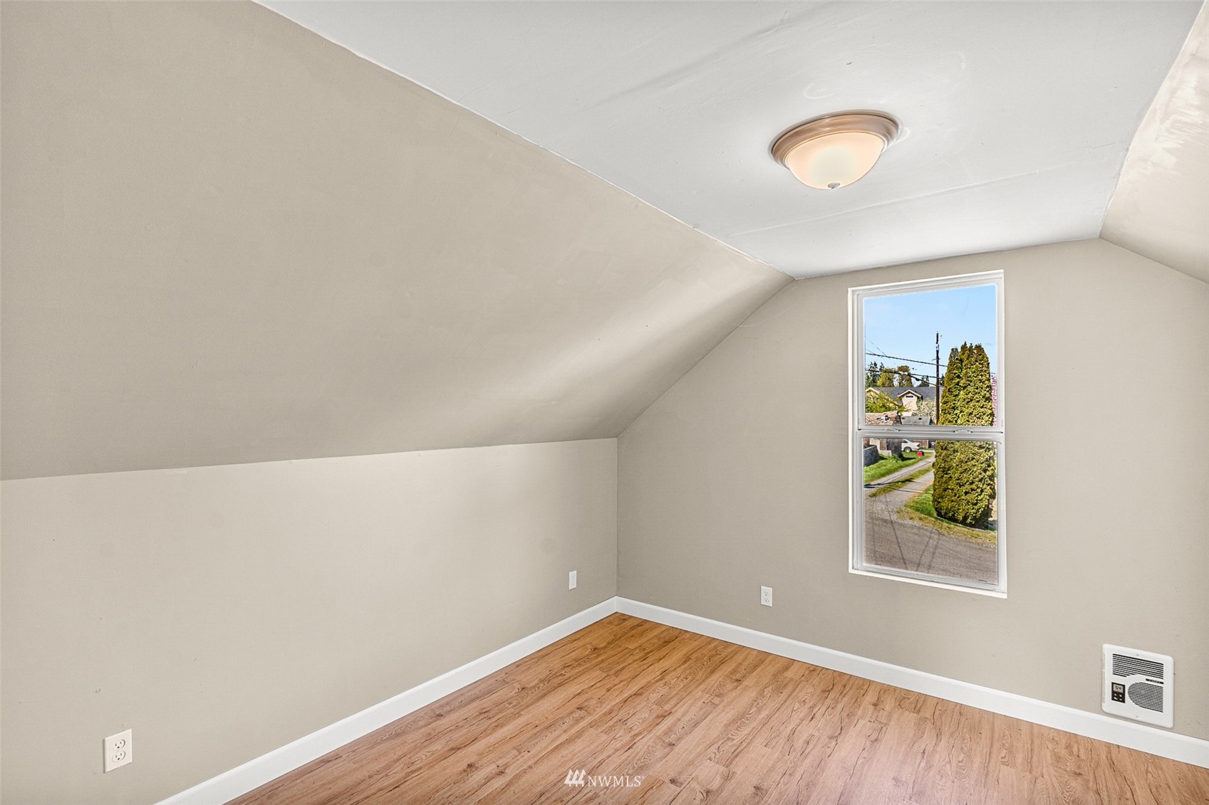 2228 Main Street Everett, WA 98203 - Photo 27 of 29 a view of room with window and wooden floor