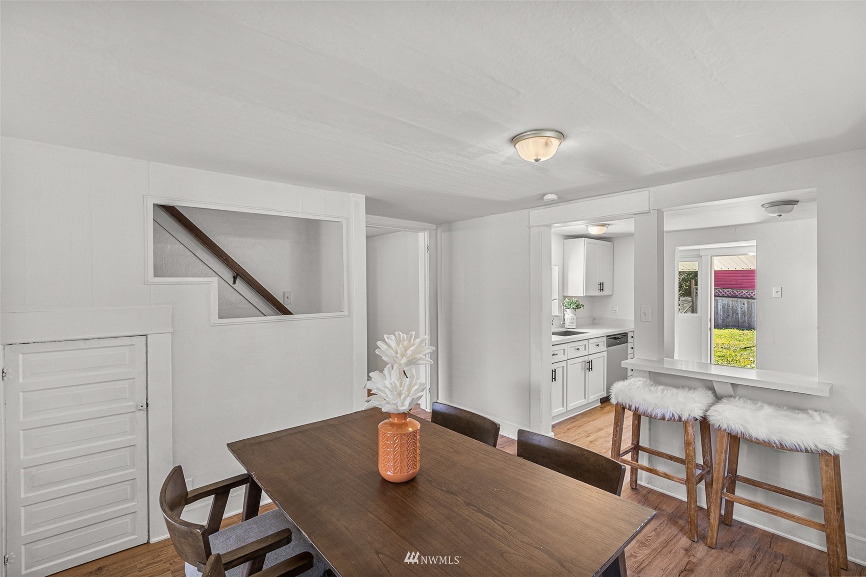 2228 Main Street Everett, WA 98203 - Photo 10 of 29 a view of a dining room with furniture and wooden floor
