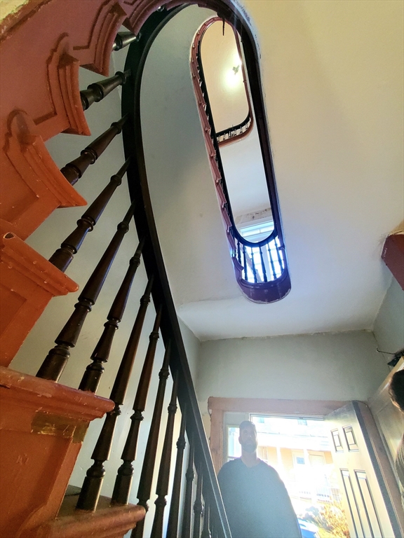 204 High Street, Unit 2 Fall River, MA 02720 - Photo 6 of 11 a view of staircase with railing and white walls