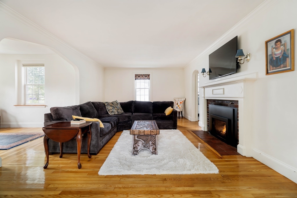 7 St Marys Road Milton, MA 02186 - Photo 4 of 31 a living room with furniture and a fireplace