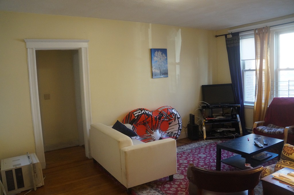 28 Ransom Road, Unit 4 Boston, MA 02135 - Photo 2 of 9 a living room with furniture and a window