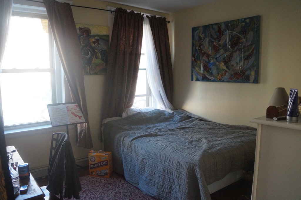 28 Ransom Road, Unit 4 Boston, MA 02135 - Photo 4 of 9 a bed sitting in a bedroom next to a window