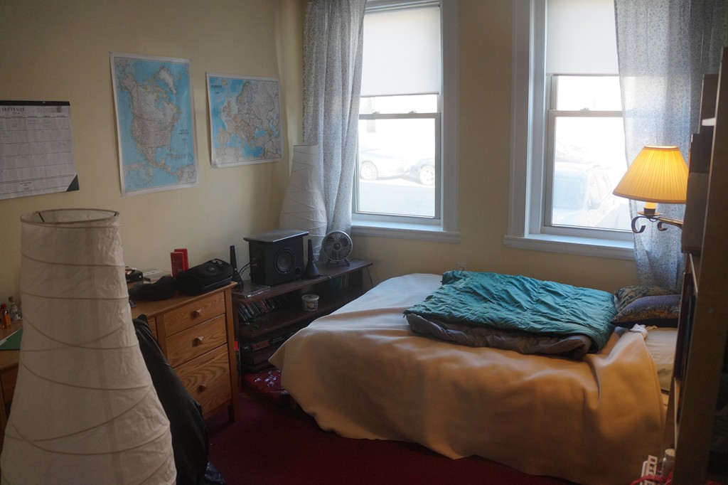 28 Ransom Road, Unit 4 Boston, MA 02135 - Photo 5 of 9 a bedroom with a bed and a window