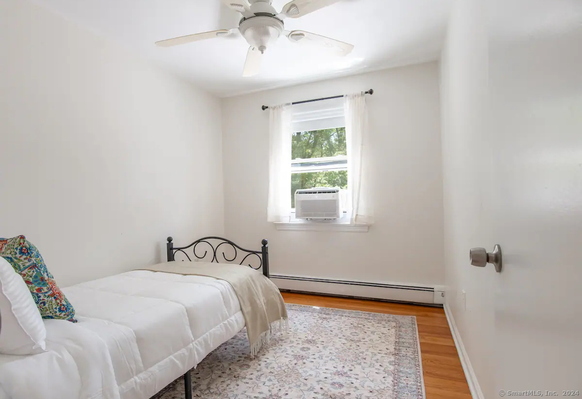 5 Hollow Spring Road Norwalk, CT 06854 - Photo 11 of 30 a bedroom with a bed and a window