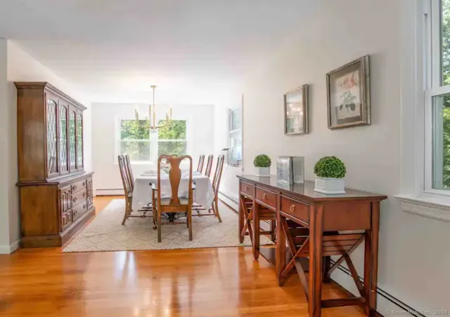 a view of a dining room with furniture window and outside view