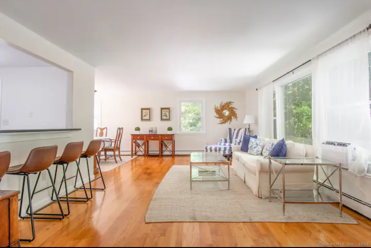 5 Hollow Spring Road Norwalk, CT 06854 - Photo 22 of 30 a living room with furniture and a large window