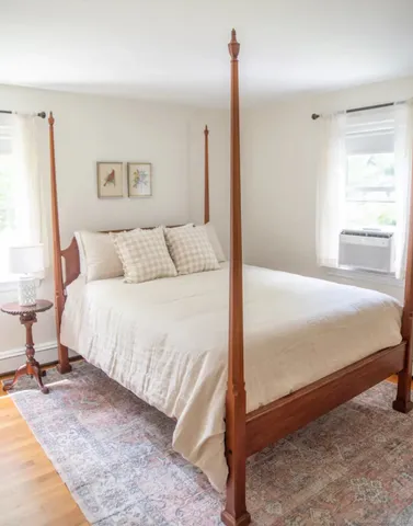 a bed room with a bed and a night stand