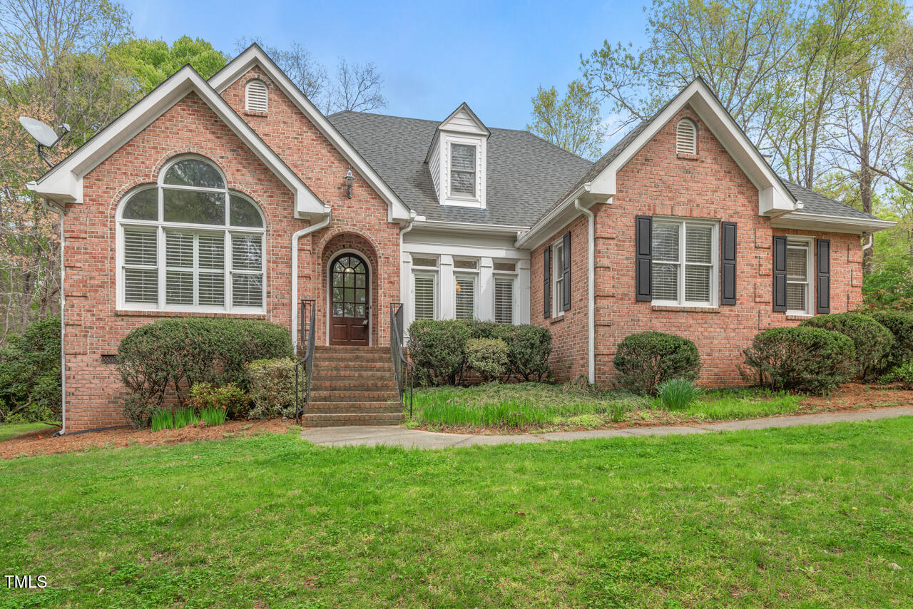 5900 Orchid Valley Road Raleigh, NC 27613 - Photo 1 of 52 a front view of a house with a yard
