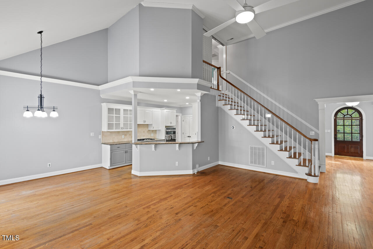 5900 Orchid Valley Road Raleigh, NC 27613 - Photo 13 of 52 a view of a room with wooden floor and a window