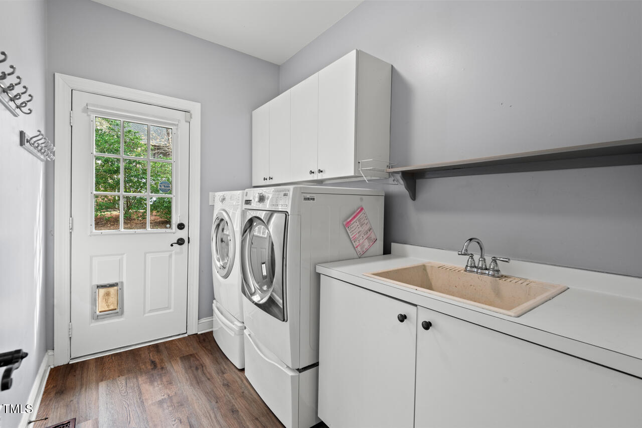 5900 Orchid Valley Road Raleigh, NC 27613 - Photo 22 of 52 a utility room with dryer and washer