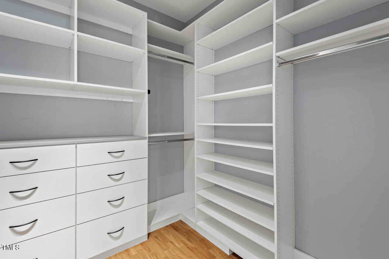 5900 Orchid Valley Road Raleigh, NC 27613 - Photo 34 of 52 a view of walk in closet with empty racks