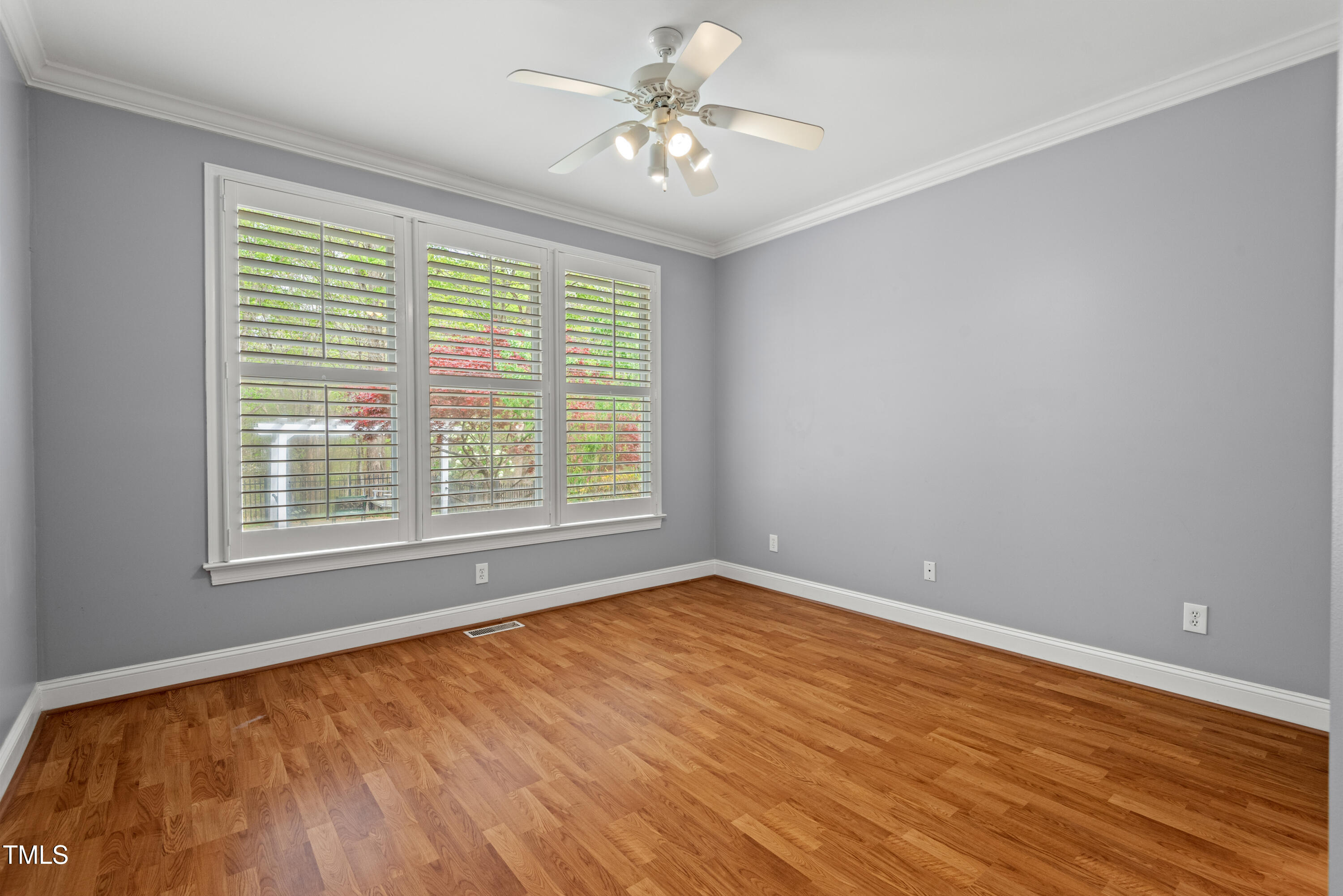 5900 Orchid Valley Road Raleigh, NC 27613 - Photo 37 of 52 a view of an empty room with window and a chandelier fan