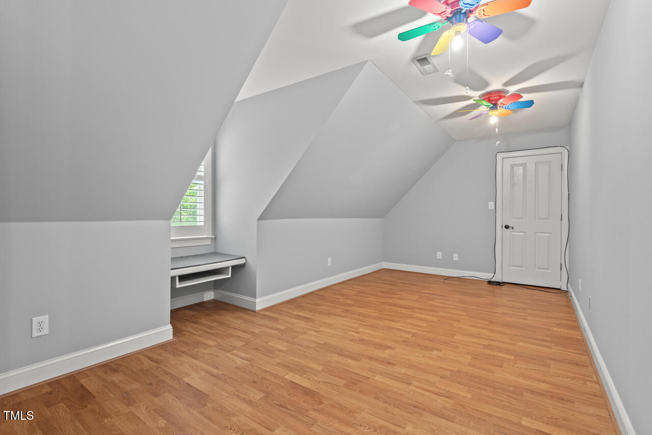 5900 Orchid Valley Road Raleigh, NC 27613 - Photo 46 of 52 wooden floor in an empty room with a window