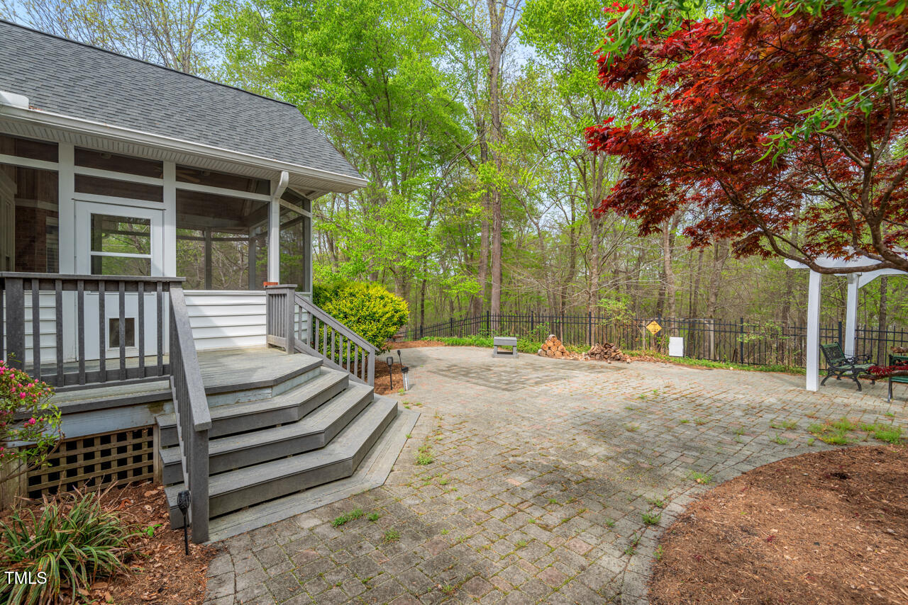5900 Orchid Valley Road Raleigh, NC 27613 - Photo 47 of 52 a view of a house with backyard and trees