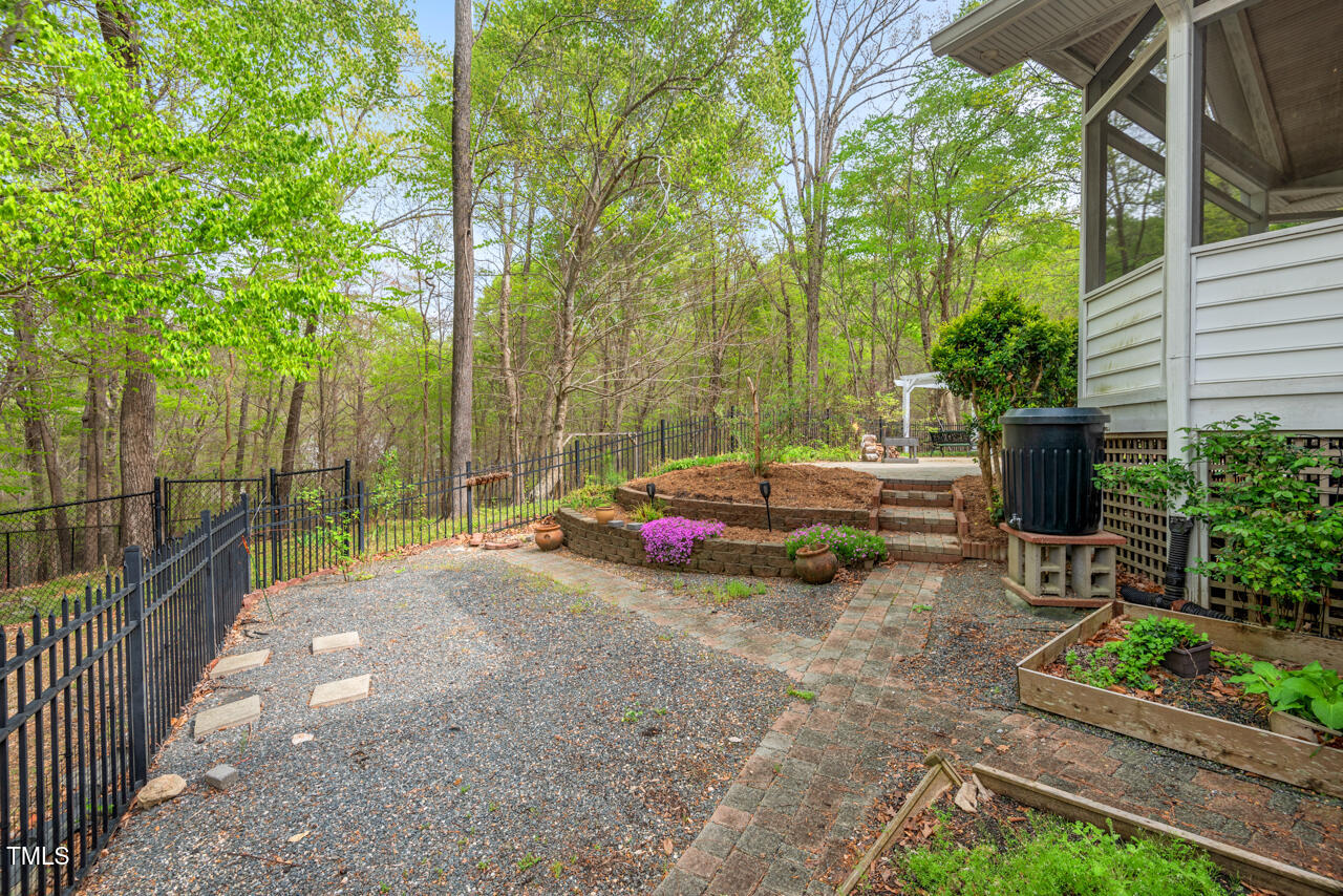 5900 Orchid Valley Road Raleigh, NC 27613 - Photo 49 of 52 a view of a backyard with sitting area