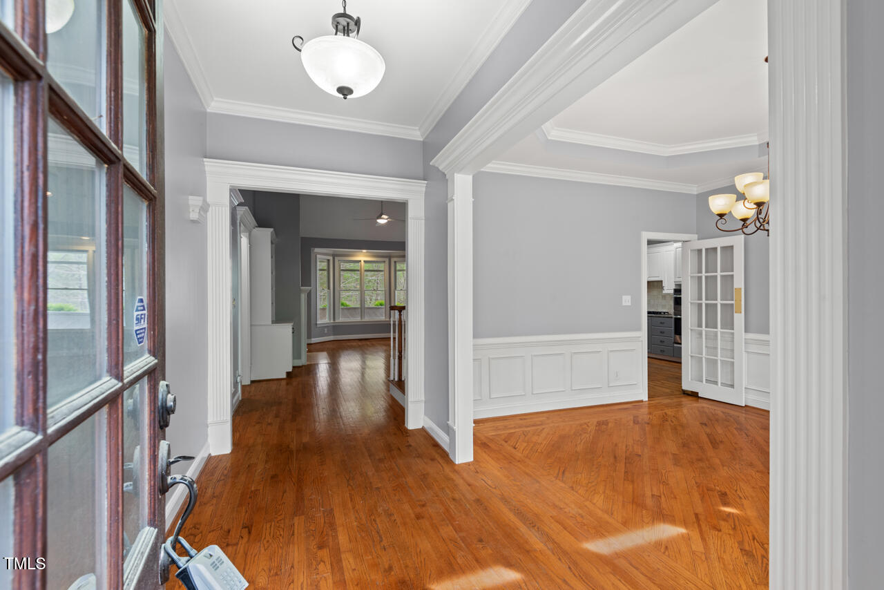 5900 Orchid Valley Road Raleigh, NC 27613 - Photo 5 of 52 a view of entryway with wooden floor