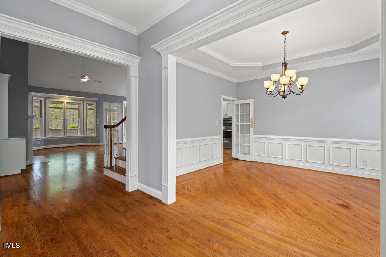 5900 Orchid Valley Road Raleigh, NC 27613 - Photo 6 of 52 a view of a room with wooden floor fireplace and windows