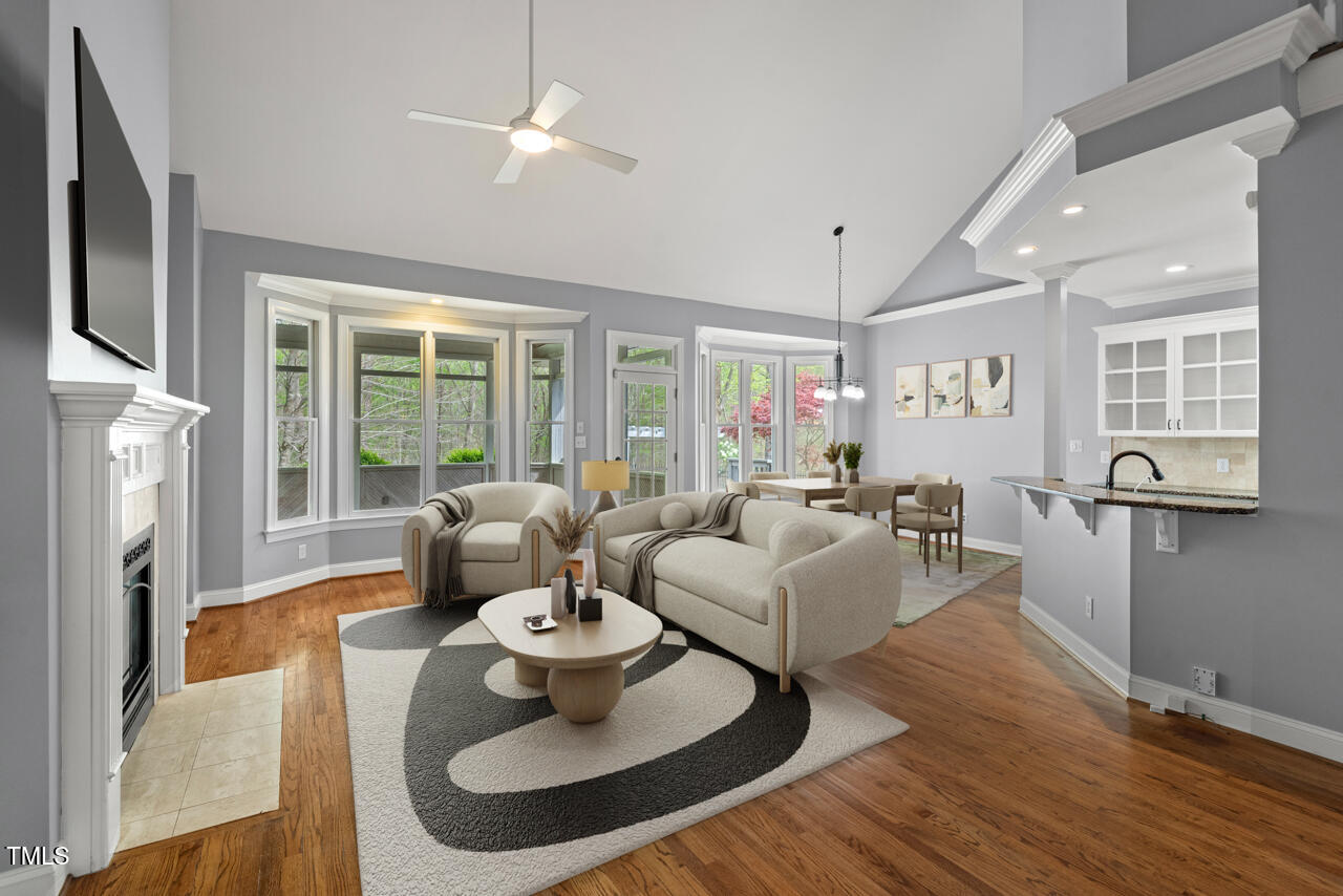 5900 Orchid Valley Road Raleigh, NC 27613 - Photo 9 of 52 a living room with fireplace furniture and a large window