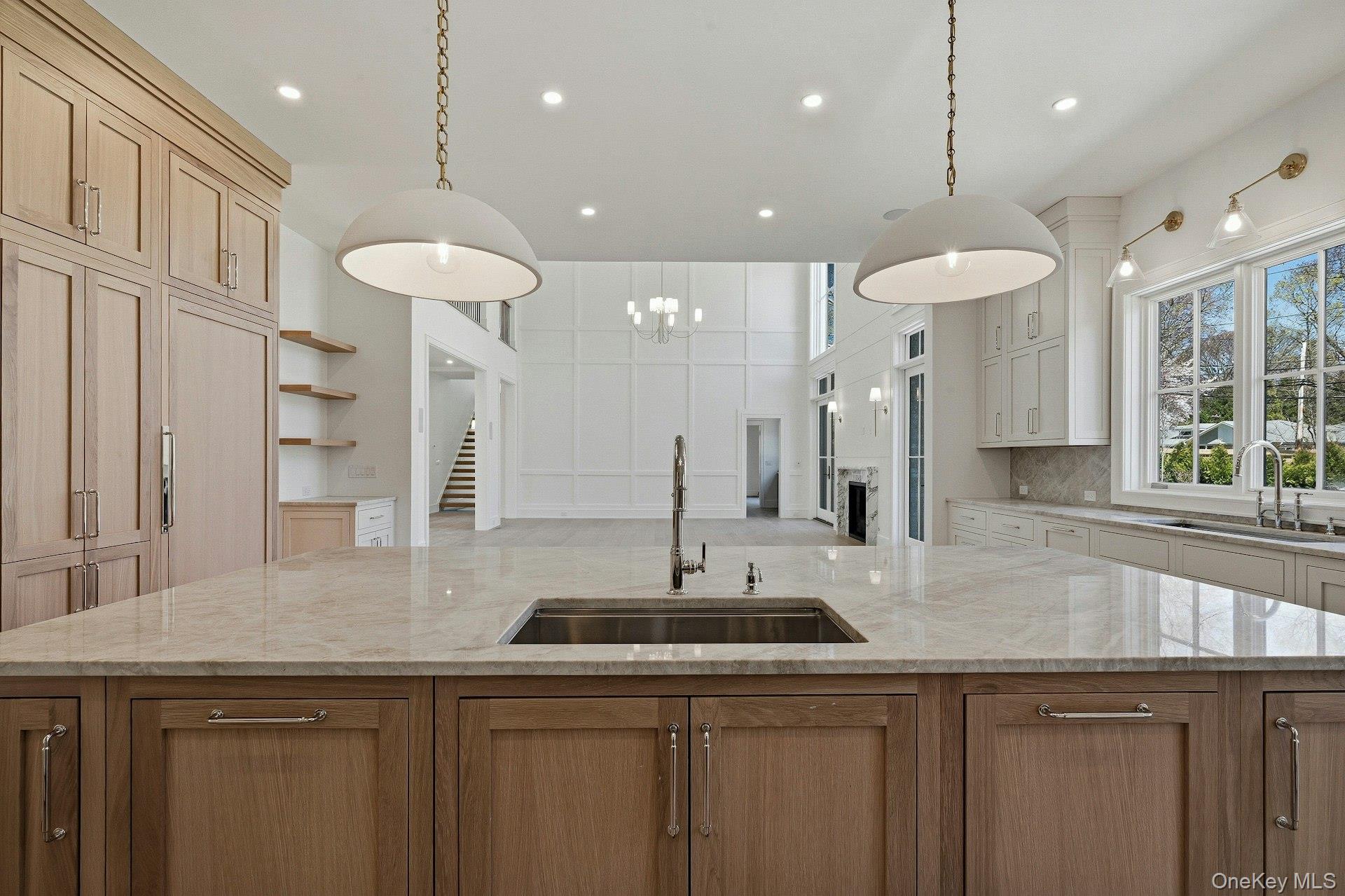 25 West Creek Farms Road Sands Point, NY 11050 - Photo 14 of 39 a kitchen with stainless steel appliances a sink and a refrigerator