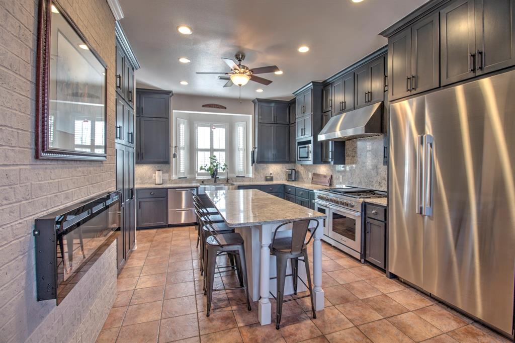4275 Old Thomas Road Aubrey, TX 76227 - Photo 11 of 31 Chefs Dream Kitchen! Dacor Luxury appliances, center island for gathering in the kitchen as you cook up your favorite dish!
